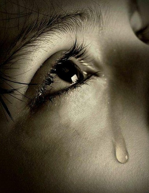 Understanding and overcoming Weltschmerz - child with a tear on its face as a symbol of world-weariness - emotional representation of compassion and inner pain