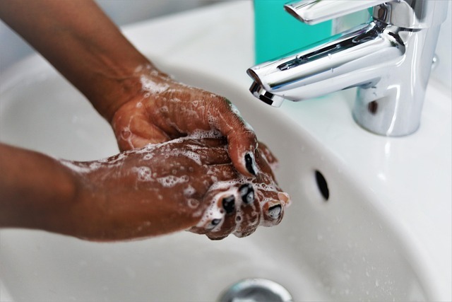 OCD: symptoms and treatment - Person with obsessive-compulsive disorder compulsively washes their hands for fear of germs - typical symptom of compulsive washing